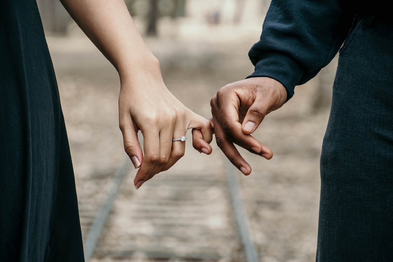 A man and a woman holding hands 